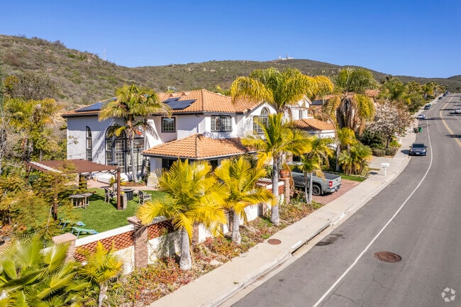 Spanish-style homes stand beneath palm trees in Rancho Peñasquitos, San Diego.