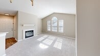 This 880 square foot apartment in Tallahassee, FL offers a harmonious blend of space and functionality. The open floor plan seamlessly integrates the living areas, creating an airy atmosphere enhanced by vaulted ceilings. Large windows, including an arched window, flood the space with natural light, while white plantation shutters provide privacy and light control.

The living room is a focal point, featuring a modern fireplace and plush carpeting. The kitchen boasts white cabinetry, subway tile backsplash, and a practical layout with ample counter space. Stainless steel appliances and wood-look flooring add contemporary touches.

Two generously sized bedrooms, including a 190 square foot primary bedroom, offer comfort and privacy. Each bedroom is equipped with ceiling fans and spacious closets with sliding doors. The two bathrooms feature clean, white fixtures and shower/tub combinations with curved curtain rods for added space.

Throughout the apartment, neutral wall colors create a versatile canvas for personal decor. The property's thoughtful design maximizes storage and living space, making it an ideal home for comfortable, modern living.