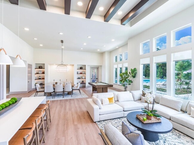 Expansive clubroom with gathering space, lounge seating, and billiards. - Beckett West Fork