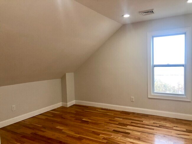 Spacious, bright bedroom #1 with ample closet space - 83 Cottage St