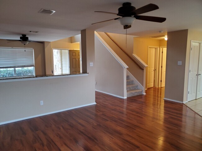 View from the back of the living room to the front door. - 228 Anvil Pl