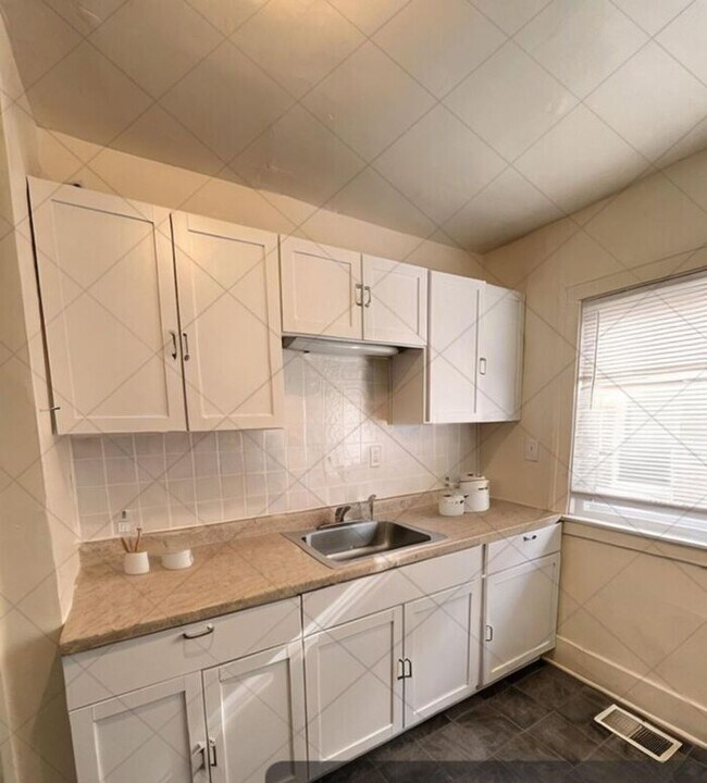 Building Photo - Cozy and Bright 2-Bedroom Duplex with Fire...