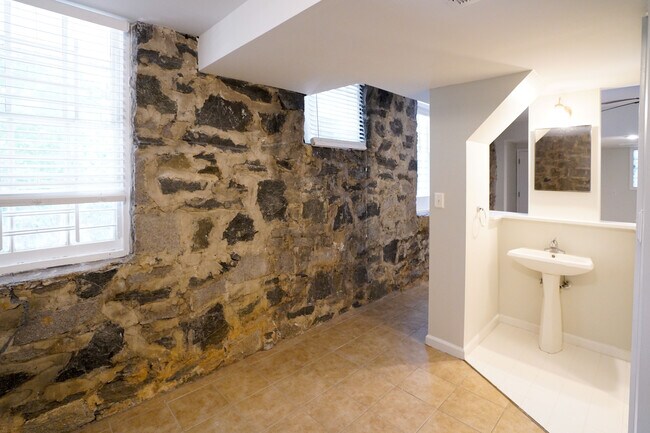 Bedroom 3 with view toward lower living room. - 1489 North Highland Avenue Northeast