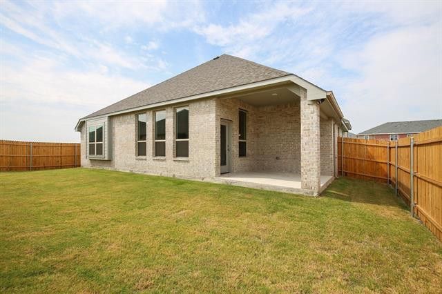 Covered patio has 2 patio chairs. Good backyard size. - 236 Painted Trail