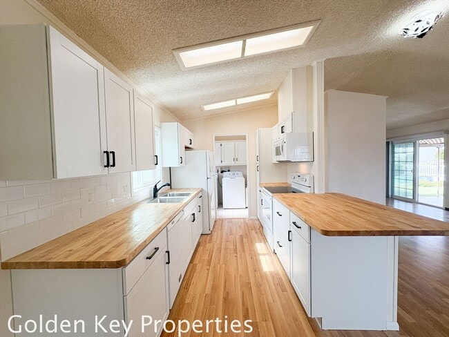Building Photo - Welcome to the spacious single-level manuf...