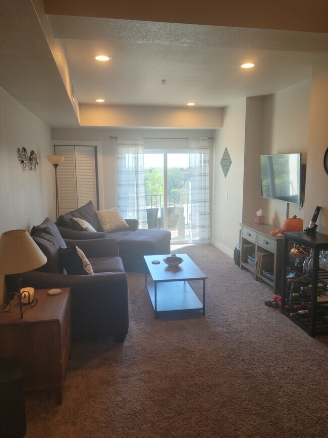 Living room and balcony - 1401 W 85th Ave