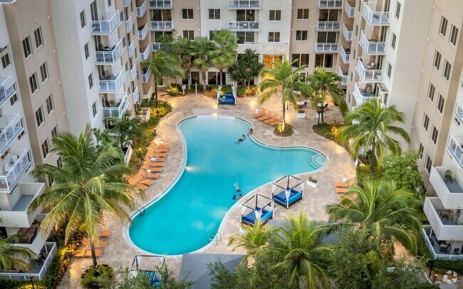 Expansive Pool with Lounge Chairs and Lush Landscaping - The Manor at CityPlace