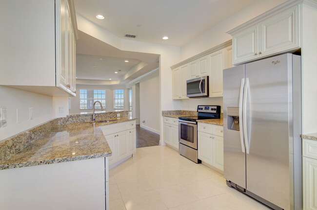 Carlsbad - Designer kitchen with stainless steel appliances and custom cabinetry - Greens Edge