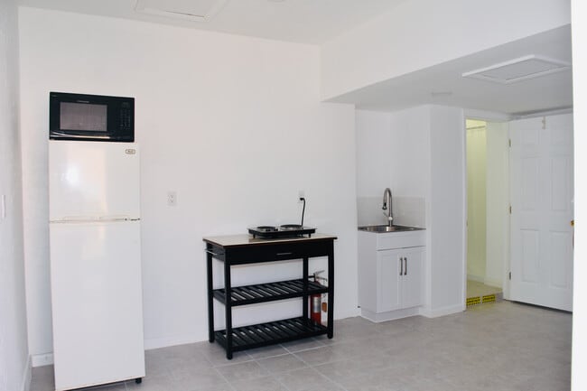 Kitchenette and bathroom door - 851 SW 49th Ter
