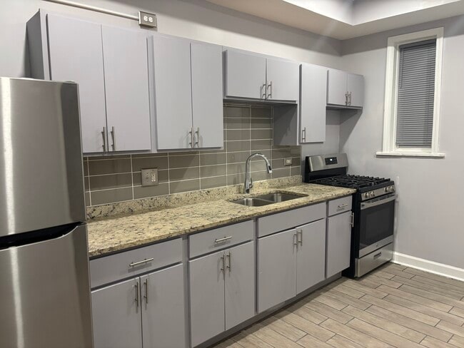 Building Photo - 6344 S Vernon Ave