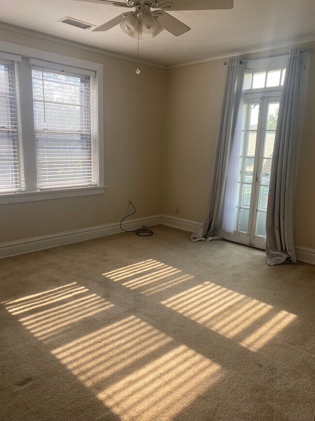 Larger bedroom with balcony - 444 S Hanley Rd