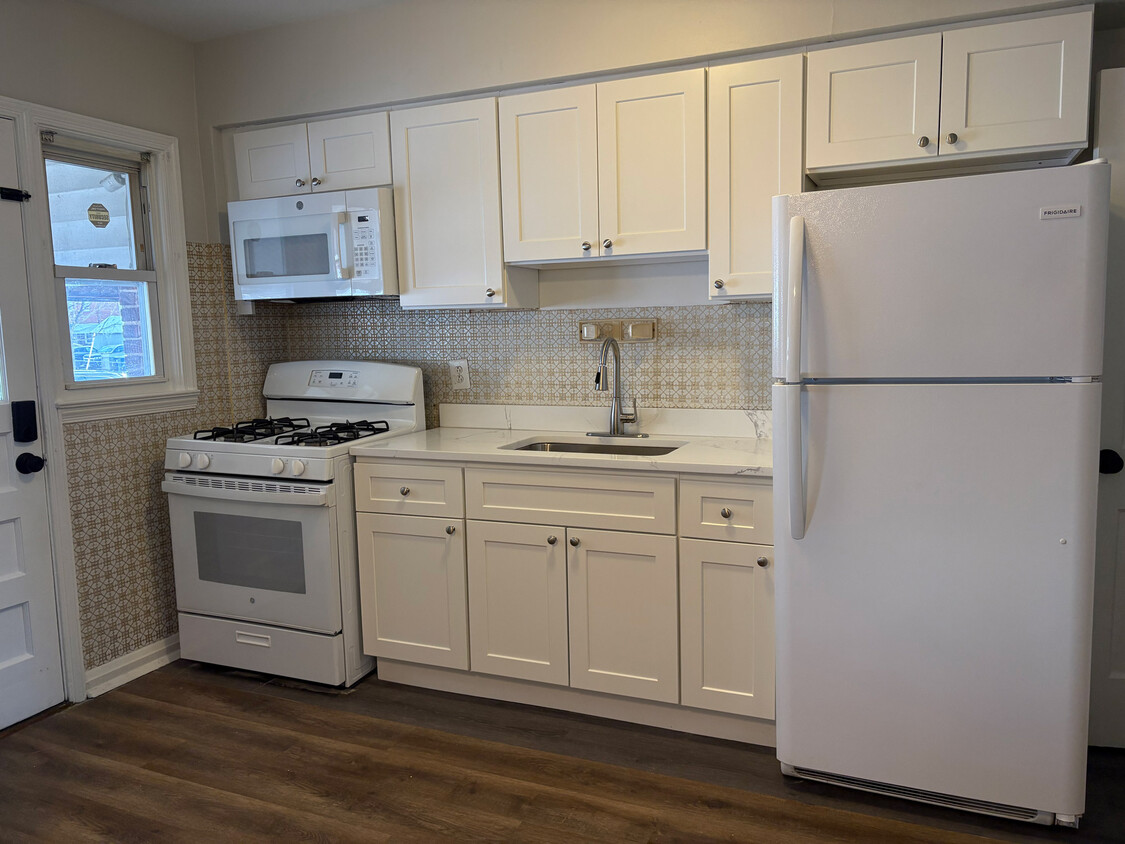 Brand new kitchen! New cabinets, quartz countertop, stove and microwave! - 7125 Gough St