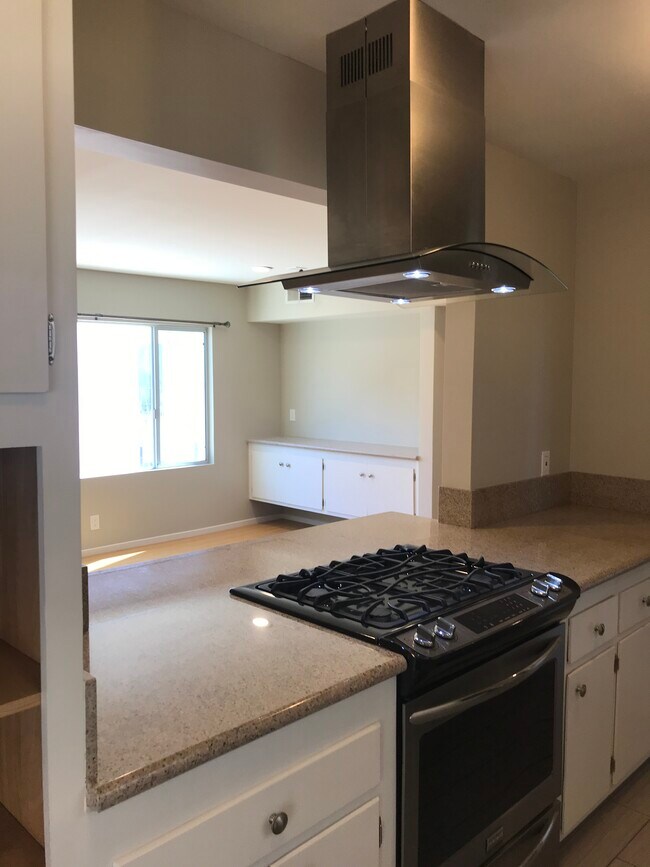 Open kitchen to living area. - 1211 Boston St