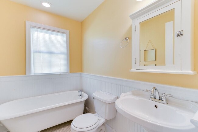 An older picture, this claw foot tub is now set up as a shower as well. - 710 N 1st St