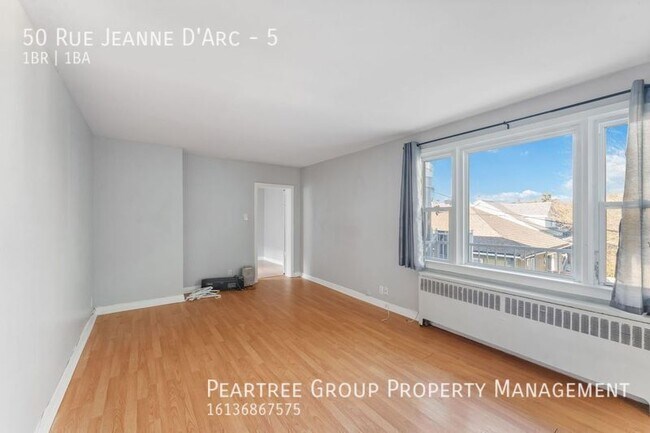 Photo du bâtiment - Joyful Jeanne-D'Arc-1 bed apartment for rent