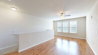 Located at 3245 Glenn McConnell Pkwy in Charleston, SC, this well-appointed one-bedroom, one-bathroom residence offers a functional and comfortable layout across a single floor. The open-concept kitchen and living area serves as the heart of the home, where rich dark-wood cabinetry, granite-style countertops, and a breakfast bar peninsula create an inviting space for both cooking and entertaining. The kitchen is fully equipped with black appliances, including a refrigerator, range, microwave, and dishwasher, complemented by track lighting and a decorative pendant light. Wood-style flooring flows throughout the main living areas, adding warmth and continuity to the space. The living room is bright and airy, with large windows dressed in blinds that invite natural light, and a ceiling fan overhead for added comfort. The spacious bedroom features plush carpeting, multiple windows, a ceiling fan, and access to a dedicated closet, offering a peaceful retreat. The full bathroom is clean and well-finished, featuring a dark-wood vanity with granite-style countertop, a large mirror, and a full soaking tub and shower combo. Neutral tones and clean white trim throughout the space lend a timeless, move-in-ready aesthetic.