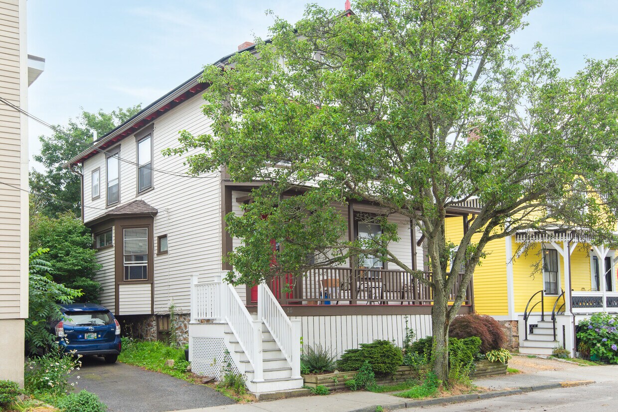 Front of house with view of front porch and parking - 16 Pond Ave