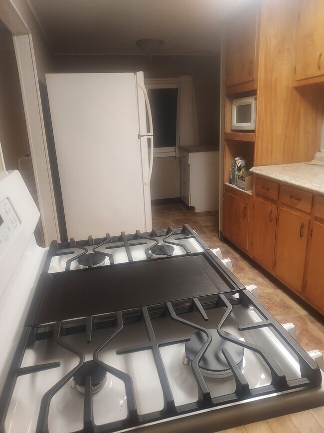 Kitchen with new stove, fridge, counter and sink. - 271 Stone Ln