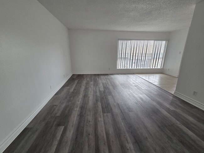 Living room with Luxury Vinyl Plank - 3455 Elm Ave