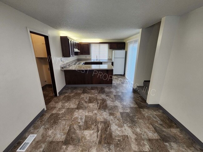 Building Photo - 3 Bd that Features Master on the Main with Fenced Yard, 2 Car Garage, & W/D Hookups