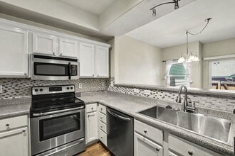 Building Photo - 9647 W Chatfield Ave