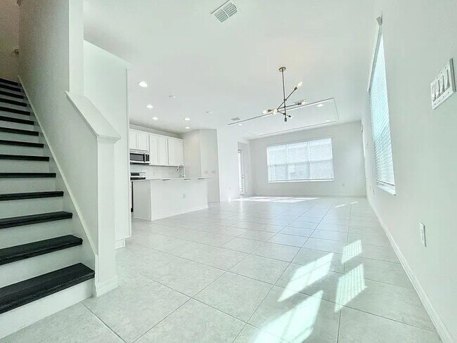 Building Photo - Modern Waterset Townhome | 4BR + Resort-Style Community Living