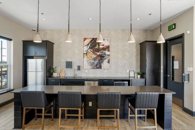 Elevate your lifestyle at Flats on Archer, where modern elegance meets functionality. Enjoy a spacious, stylish kitchen perfect for entertaining or unwinding after a long day. Schedule a tour today to see your new home! - Flats on Archer