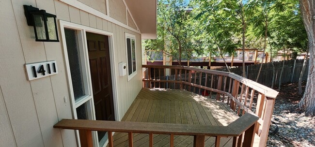 Front Deck. Plenty of room for relaxing on chairs and table. - 1411 E Hays St