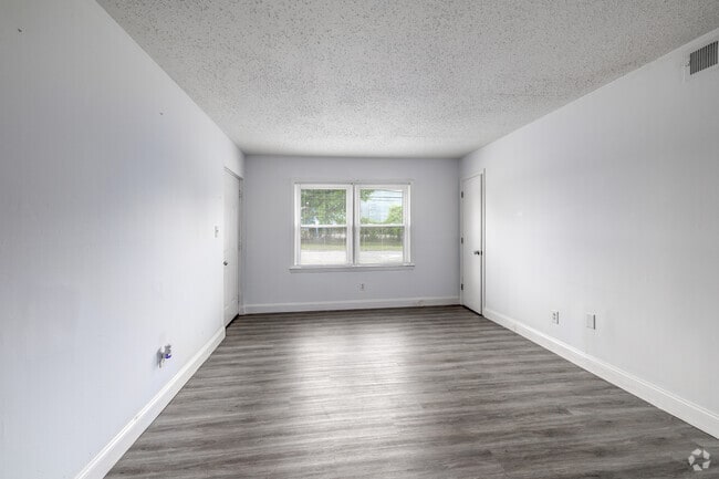 2BR, 1BA - 800SF - Living Room - Derita Woods Apartments