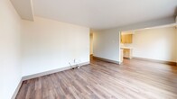 Located at 8415 NE Hazel Dell Ave in Vancouver, WA, this 2-bedroom, 1-bathroom unit offers a practical and clean layout across a single floor. The open-concept kitchen and living area forms the heart of the home, with the galley-style kitchen featuring light wood cabinetry, white countertops, a stainless steel sink, and white appliances including a range and refrigerator. The living area flows naturally from the kitchen, bathed in natural light from a large window with outdoor views.

Both bedrooms are bright and inviting, each featuring wood-style laminate flooring, neutral walls, and windows that bring in natural light. The primary bedroom offers a comfortable footprint with generous closet access. Throughout the unit, five closets provide ample storage solutions.

The full bathroom is clean and functional, finished with light wood vanity cabinetry, white countertops, a wall-mounted medicine cabinet, a large mirror, and a tub/shower combination with grab bars. The consistent use of wood-style flooring across the living spaces and neutral tones throughout lend the unit a cohesive, modern feel. The overall design is practical and move-in ready, ideal for those seeking a well-organized living space in Vancouver, WA.