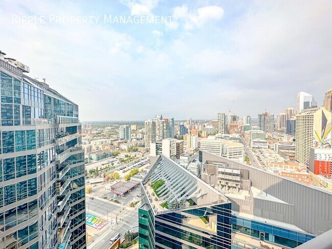 Photo du bâtiment - AMAZING 1 BED/ 1 BATH CONDO IN THE COMMUNITY OF VICTORIA PARK