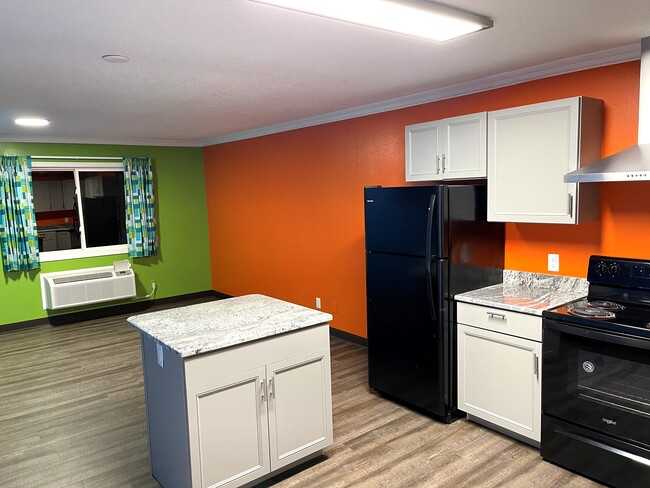 KITCHEN WITH ISLAND - 635 8th Ave SW