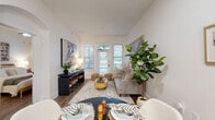 Located at 1924 Monroe Dr NE in Atlanta, GA, this one-bedroom, one-bathroom unit offers a well-designed layout that maximizes every square foot of living space. The open-concept kitchen and living area serves as the heart of the home, where crisp white shaker cabinetry, white quartz countertops, a subway tile backsplash, and stainless steel appliances create a clean, modern kitchen. A built-in pantry provides additional storage. Hardwood-style flooring runs consistently throughout, lending warmth and visual continuity to the space. The living room is bright and inviting, with large windows and a glass-paned door that flood the area with natural light and offer views of the surrounding greenery. The bedroom is a comfortable retreat, featuring a ceiling fan, windows with outdoor views, and ample room for a full furniture arrangement. A dedicated closet provides organized storage. The bathroom showcases a clean, contemporary design with white cabinetry, a rectangular vanity mirror with black metal framing, black hardware accents, and hardwood-style flooring that ties back to the rest of the unit. Throughout the space, white walls and neutral tones create a bright, cohesive ambiance well suited for modern living.