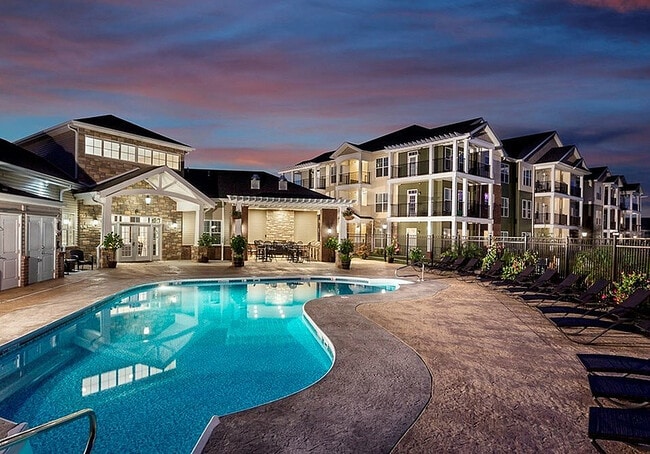 The outdoor fireplace, lounge, and grilling station opens up to Waterstone's pool and sundeck. - WaterStone at Green River