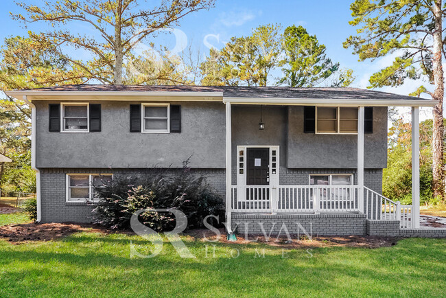Building Photo - Welcome to this charming abode.