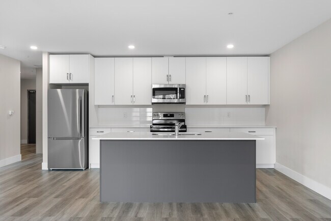 Photo du bâtiment - 1 Bedroom + Den Elation Suites - Plan B