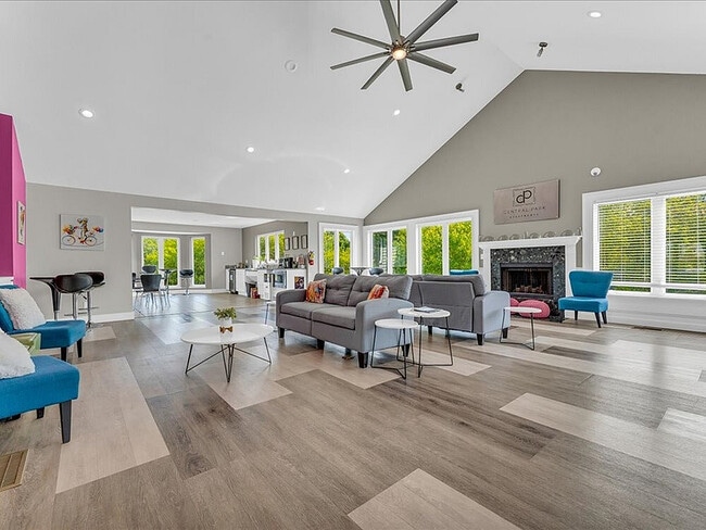 Clubhouse community room with fireplace - Central Park Apartments