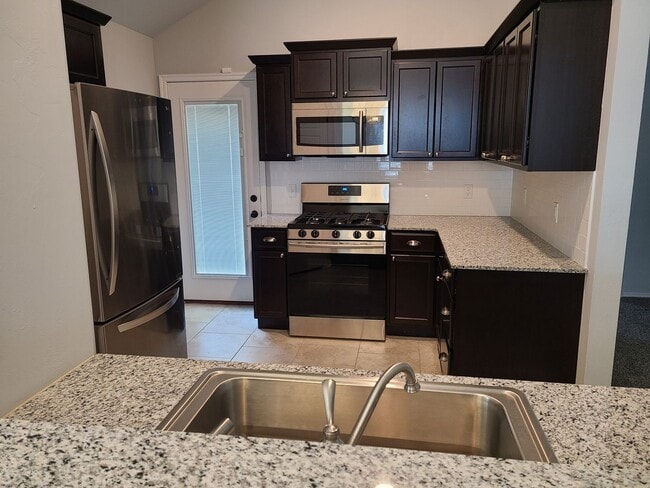 Photo - Open floor plan, Fridge included, fully fenced yard, neighborhood playground. House