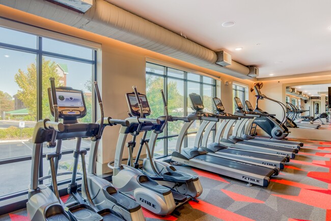 Our fitness center features state-of-the-art equipment and Fitness On Demand. - Stadium Walk By Windsor