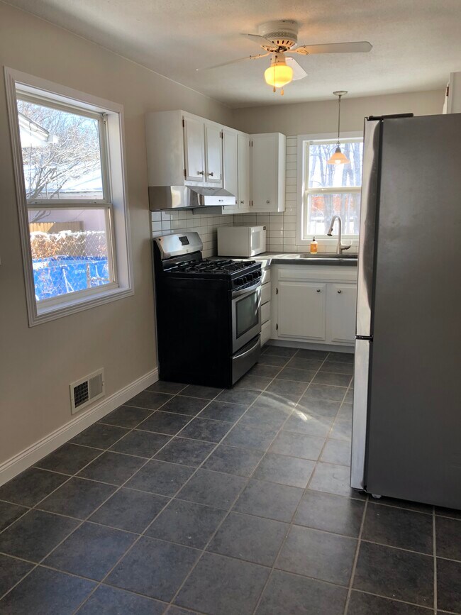 Place for a breakfast nook or additional prep space - lots of light in the kitchen! - 1966 Maryland Ave E