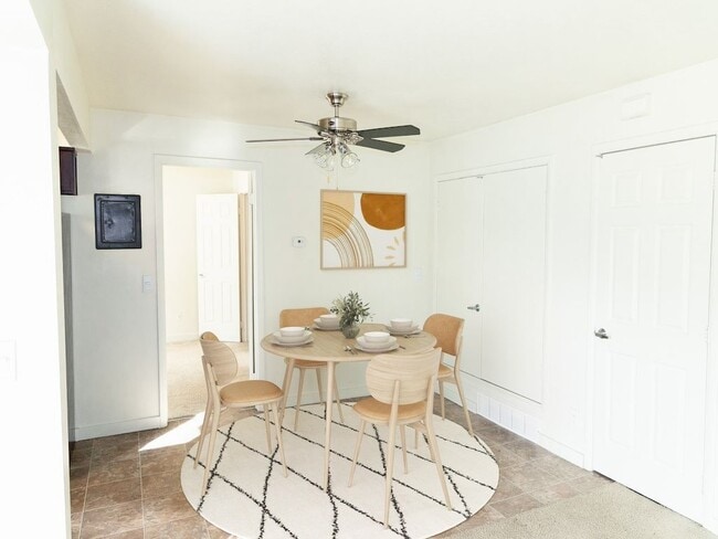 Dining Area with Ceiling Fan - Crossroads Apartments