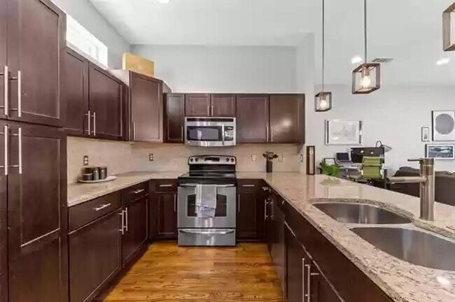 Building Photo - Beautiful Three-Story Corner Condo availab...