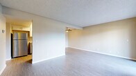 Located in Dixon, CA, this two-story, 3-bedroom, 2-bathroom home offers a functional and well-appointed layout across two floors. The main level features a spacious living room with light grey laminate flooring, neutral wall tones, a textured ceiling, and a ceiling fan. Sliding glass doors lead to a private outdoor patio, filling the space with natural light and outdoor views. The galley-style kitchen is thoughtfully updated with white shaker cabinetry, granite-style countertops, a subway tile backsplash, a stainless steel sink with a gooseneck faucet, and stainless steel appliances including a dishwasher and refrigerator. A full bathroom with a vanity featuring granite countertops and a tub/shower combo is also found on this level. Upstairs, three carpeted bedrooms each include ceiling fans and windows that bring in natural light. The bedrooms offer closet space, with at least one featuring mirrored sliding closet doors. A second full bathroom with a vanity and toilet completes the upper floor. Additional highlights include a utility room, multiple closets throughout, and a hallway connecting the upstairs rooms. The home's two-story layout provides a clear separation between living and sleeping areas.