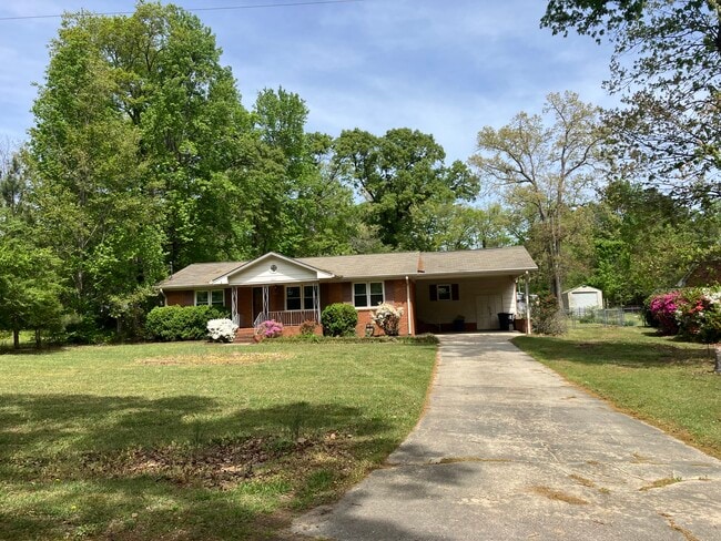 Front of house showing 2 car carport - 3608 Red Bud St