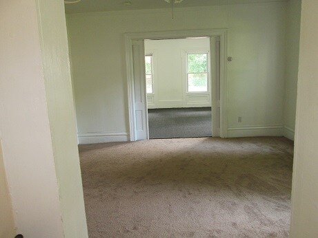 Living room w/ view into bedroom - 54 East St