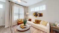 Located at 3100 Ascend Loop in Leland, NC, this well-appointed single-floor residence offers a smartly utilized layout encompassing one bedroom, one bathroom, a living room, kitchen, and closet. A welcoming entryway featuring light hardwood-style flooring and clean white walls sets the tone for the home's bright, modern aesthetic throughout.

The kitchen stands out as a centerpiece of the home, boasting white shaker-style cabinetry, granite countertops, a classic subway tile backsplash, and a full suite of stainless steel appliances. A central island provides additional prep space and casual seating, while multiple windows flood the space with natural light. A separate door offers convenient outdoor access.

The living room is a comfortable retreat, featuring large windows that bring in abundant natural light, a ceiling fan, and neutral tones that create a warm, inviting atmosphere.

The bedroom is a serene, carpeted space with natural light streaming through well-appointed windows and ample room for furnishings. It is conveniently connected to the bathroom and closet, creating a cohesive private suite. The bathroom continues the home's refined design language with granite-topped white cabinetry and hardwood-style flooring. The overall ambiance of this residence is clean, modern, and move-in ready.