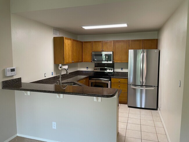 Kitchen with new refrigerator - 12 Kai Makani Loop