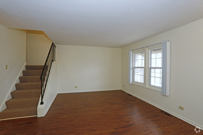 3BR, 1.5BA - Living Room - Squire Village Apartments