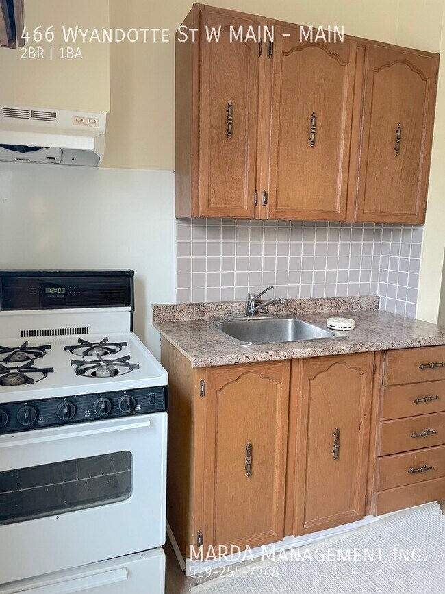 Building Photo - COZY 2 BEDROOM 1 BATH MAIN FLOOR UNIT+ 50%...