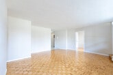 Located at 6161 Bathurst St in Toronto's North York neighbourhood, this 2-bedroom, 1-bathroom unit offers a functional and comfortable layout across a single floor. The living room is a standout space, featuring warm parquet wood flooring and a wide bank of windows that flood the room with natural light while offering pleasant views of the surrounding greenery and cityscape. Baseboard heating runs beneath the windows, ensuring year-round comfort.

The kitchen is efficiently designed with grey cabinetry, granite-style countertops, a double sink, and white appliances including a refrigerator and electric range. The marble-look tile flooring adds a clean, modern touch. Both bedrooms continue the parquet flooring theme, with the primary bedroom offering a comfortable footprint and natural light through well-sized windows. The second bedroom is similarly bright and functional.

The bathroom features white subway tile surrounding a full soaker tub and shower combination, with chrome fixtures lending a clean, classic finish. A dedicated closet provides additional storage. The unit's neutral colour palette and practical layout make it a versatile and welcoming space in a well-established Toronto location.